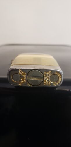 Vintage scripto vu lighter gold finger, gold infinity symbol, cream color band, chrome top. in working order