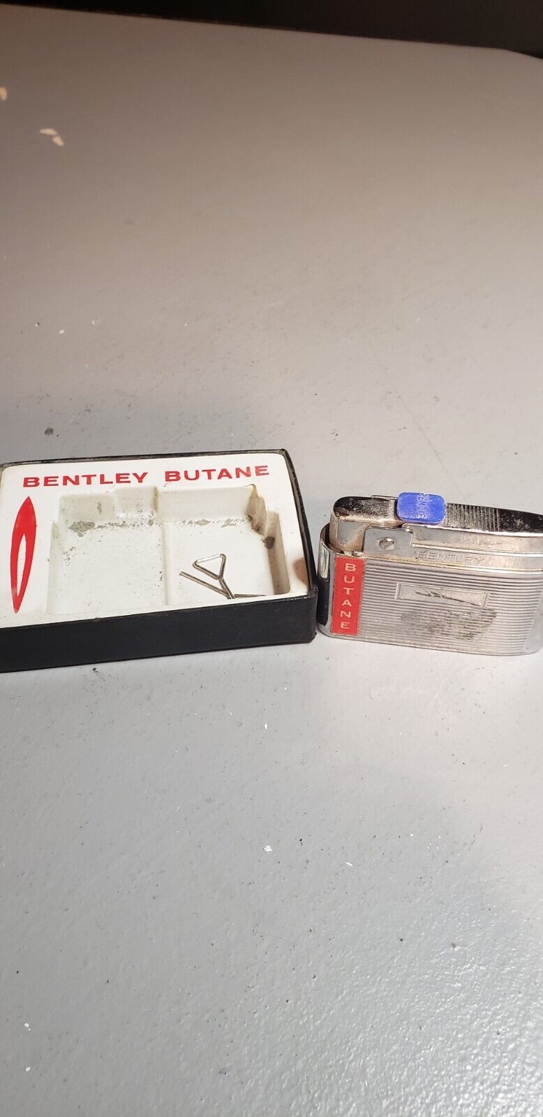Bentley Butane Lighter in original box. never been struck, lines, needs some tlc