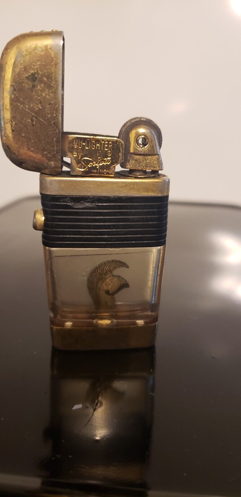 Vintage Scripto VU Lighter w/Michigan helmat, in working order.